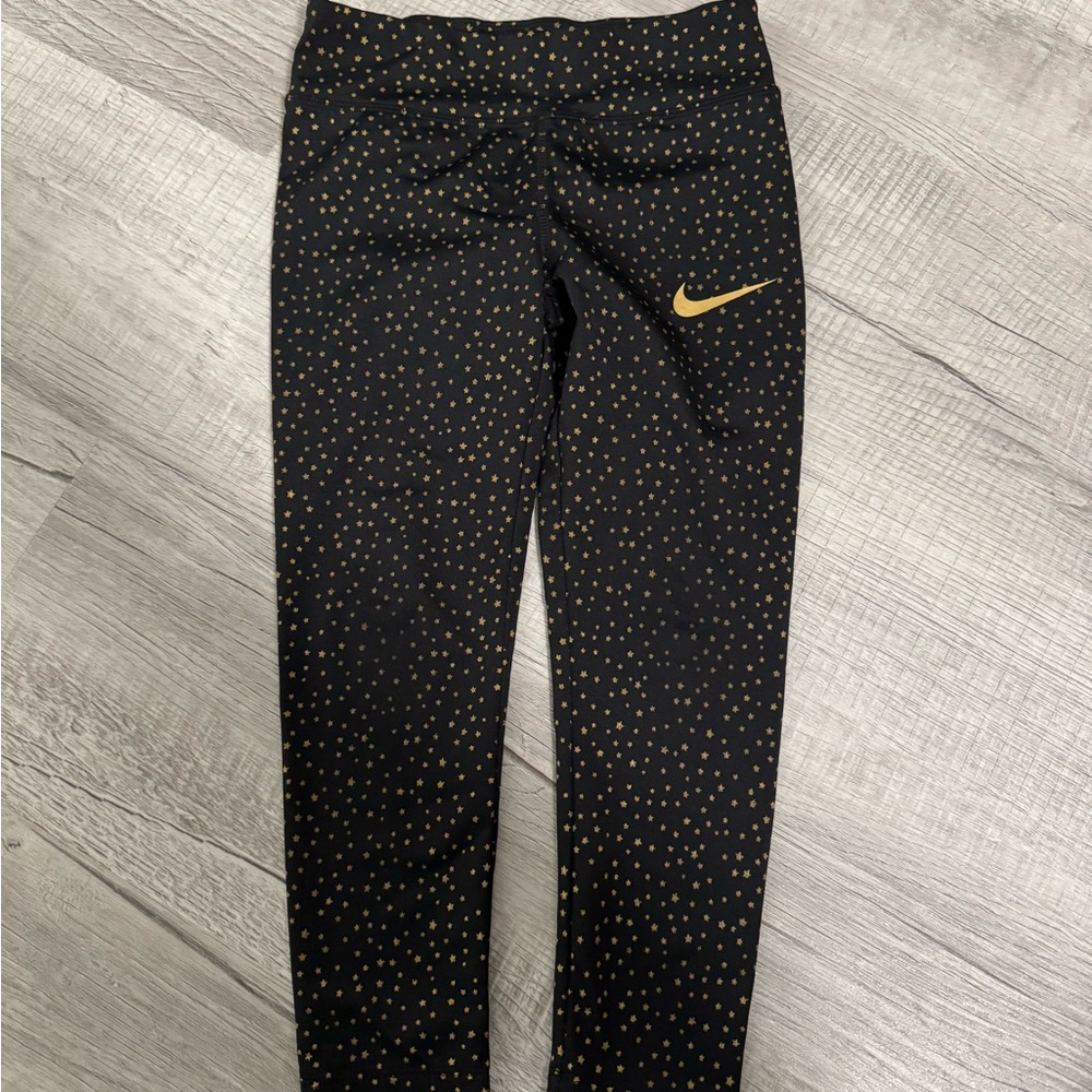 Nike Black and Gold Leggings with Subtle Pattern
